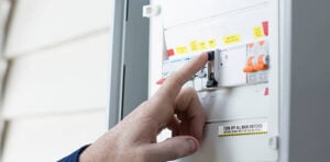 High-quality electrician inspecting electrical circuit breaker panel in Perth, ensuring safety and compliance for residential or commercial electrical systems.