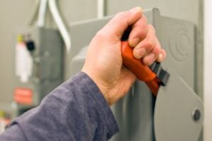 High-quality electrician working with electrical panel, showcasing electrical troubleshooting and repair services by Westline Electricians Perth in a professional Perth electrical industry setting.