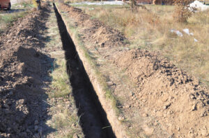 Digging trenches for underground cabling installation